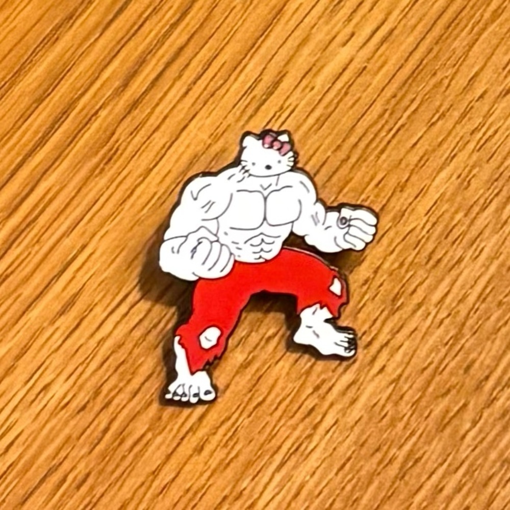 Womenโs Accessories Buff Muscular Strong Hello Kitty Multicolored Enamel Pin